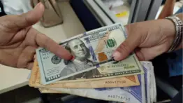 Cifras oficiales: transacciones en bolívares superan al dólar tras eliminación del IGTF