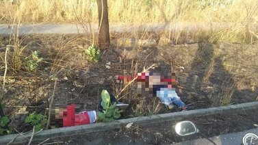 Encuentran los cuerpos de dos hombres baleados y con carteles en el pecho
