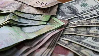 Nuevo sistema de divisas devalúa moneda y oxigena poco el mercado venezolano